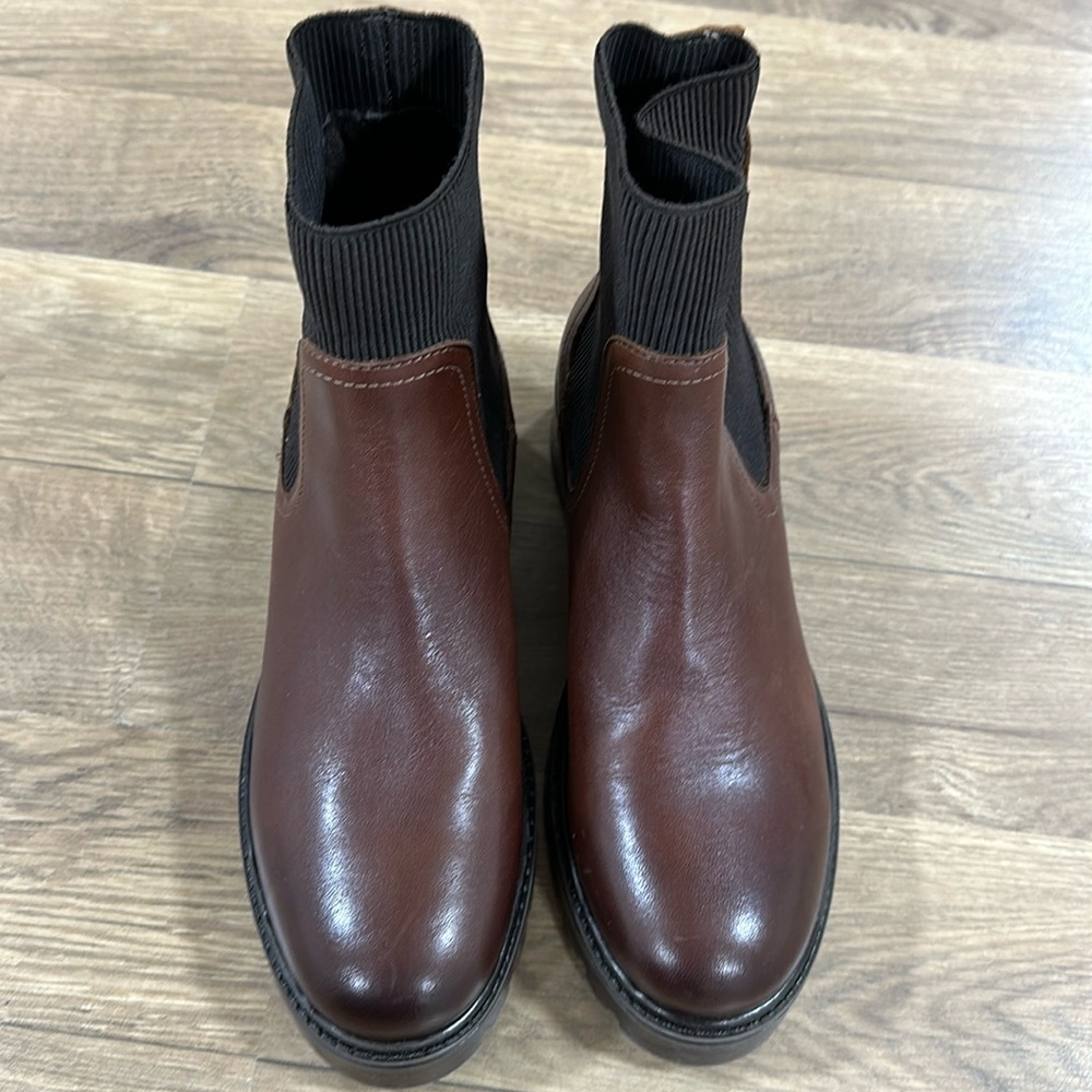 New faux leather boots with stretch fabric .